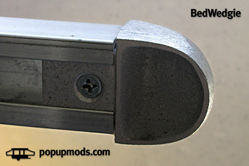 Image of a BedWedgie cast aluminum bed rail end by popupmods.com